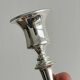 Pair of white metal candlesticks