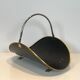 Neoclassical log holder in brass and black lacquered brass