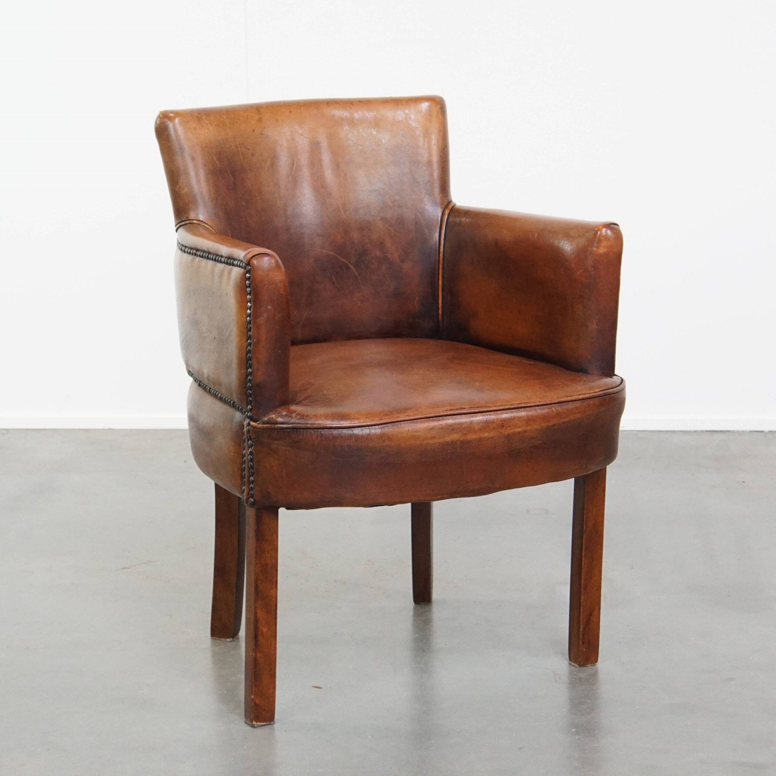 Amazing cognac-coloured sheepskin dining/side chair with armrests