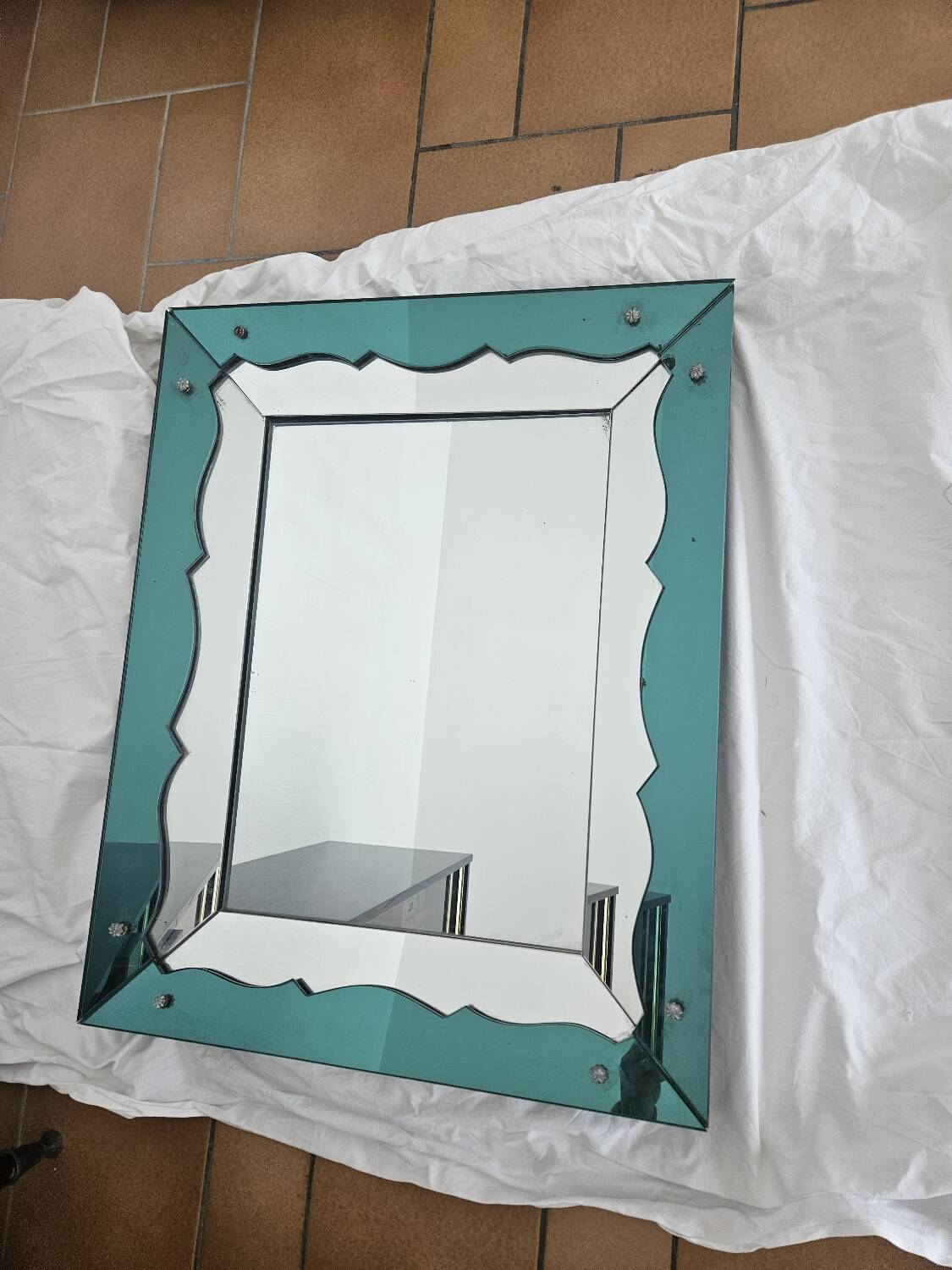 Turquoise green mirror in Hollywood Regency style