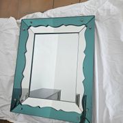 Turquoise green mirror in Hollywood Regency style