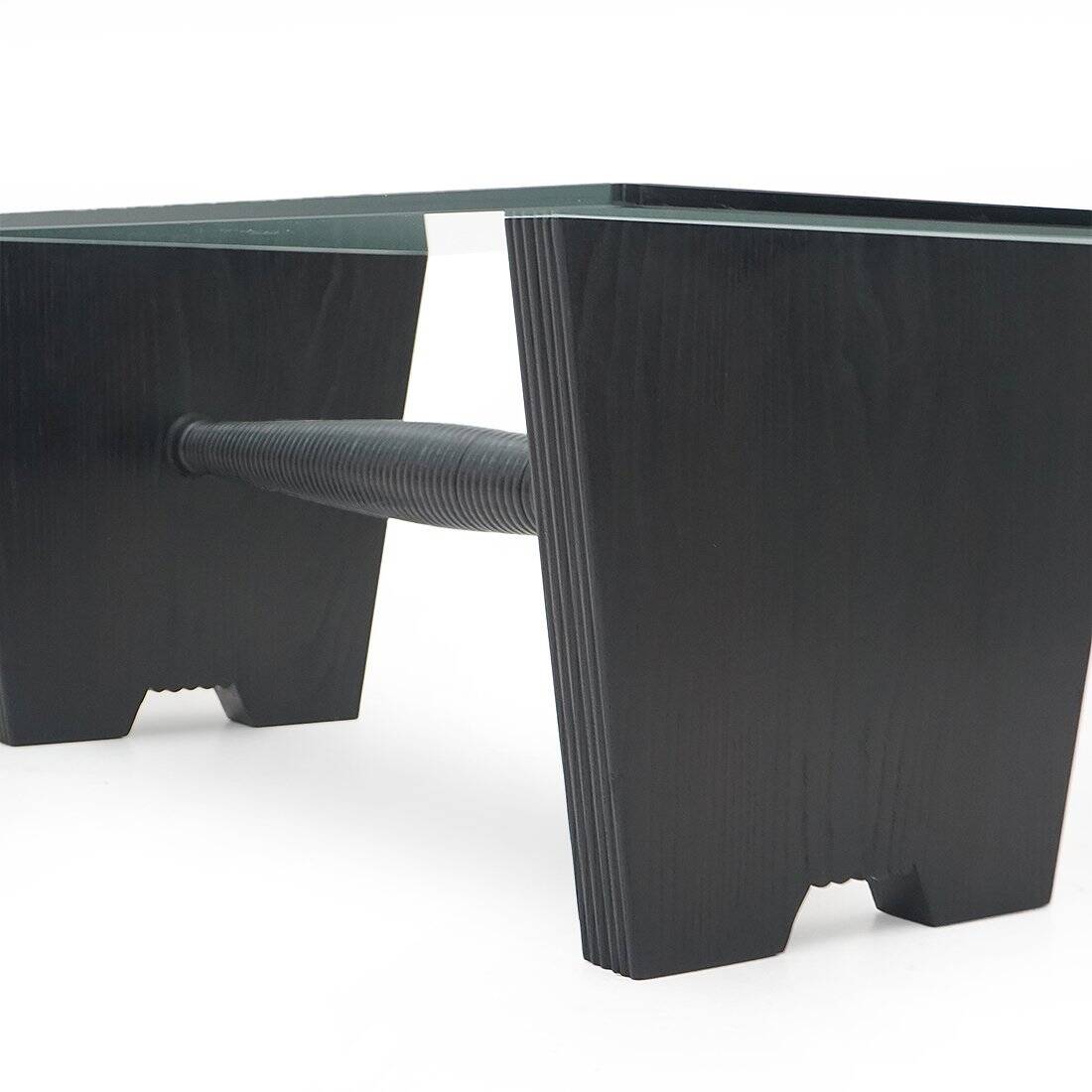 Coffee table with a glass top and black stained wood frame, 1930s.