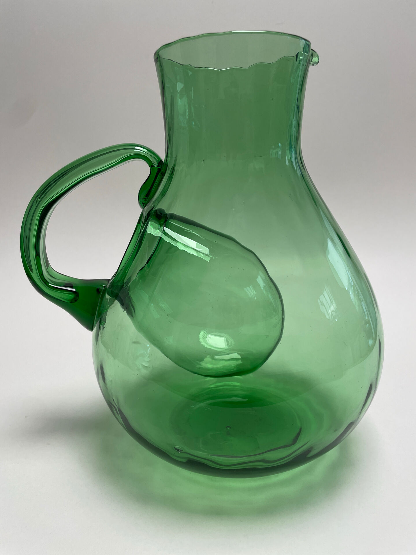 Large green glass cooling jug