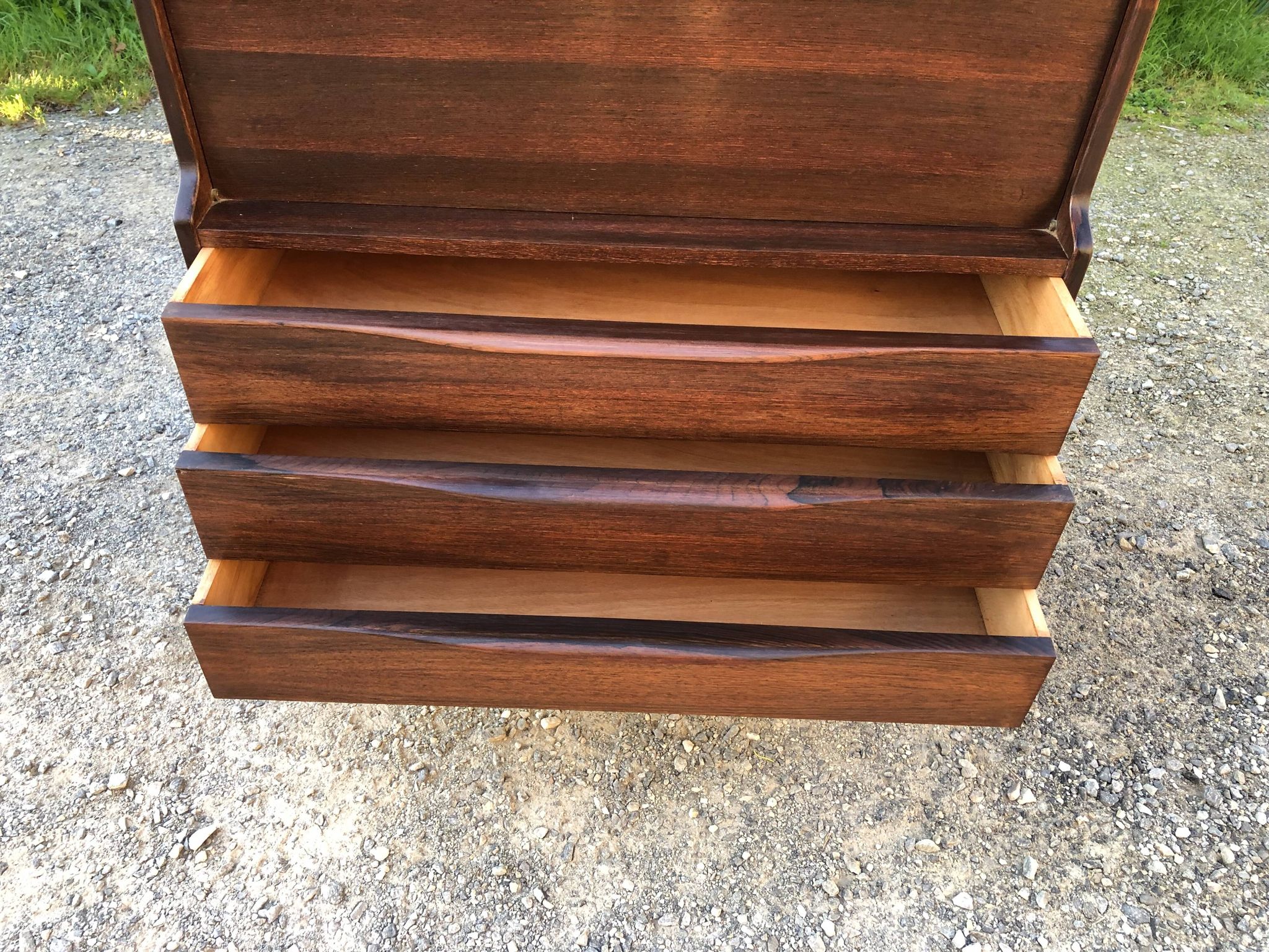 Vintage Scandinavian secretary in rosewood with drawers featuring fin-style handles.