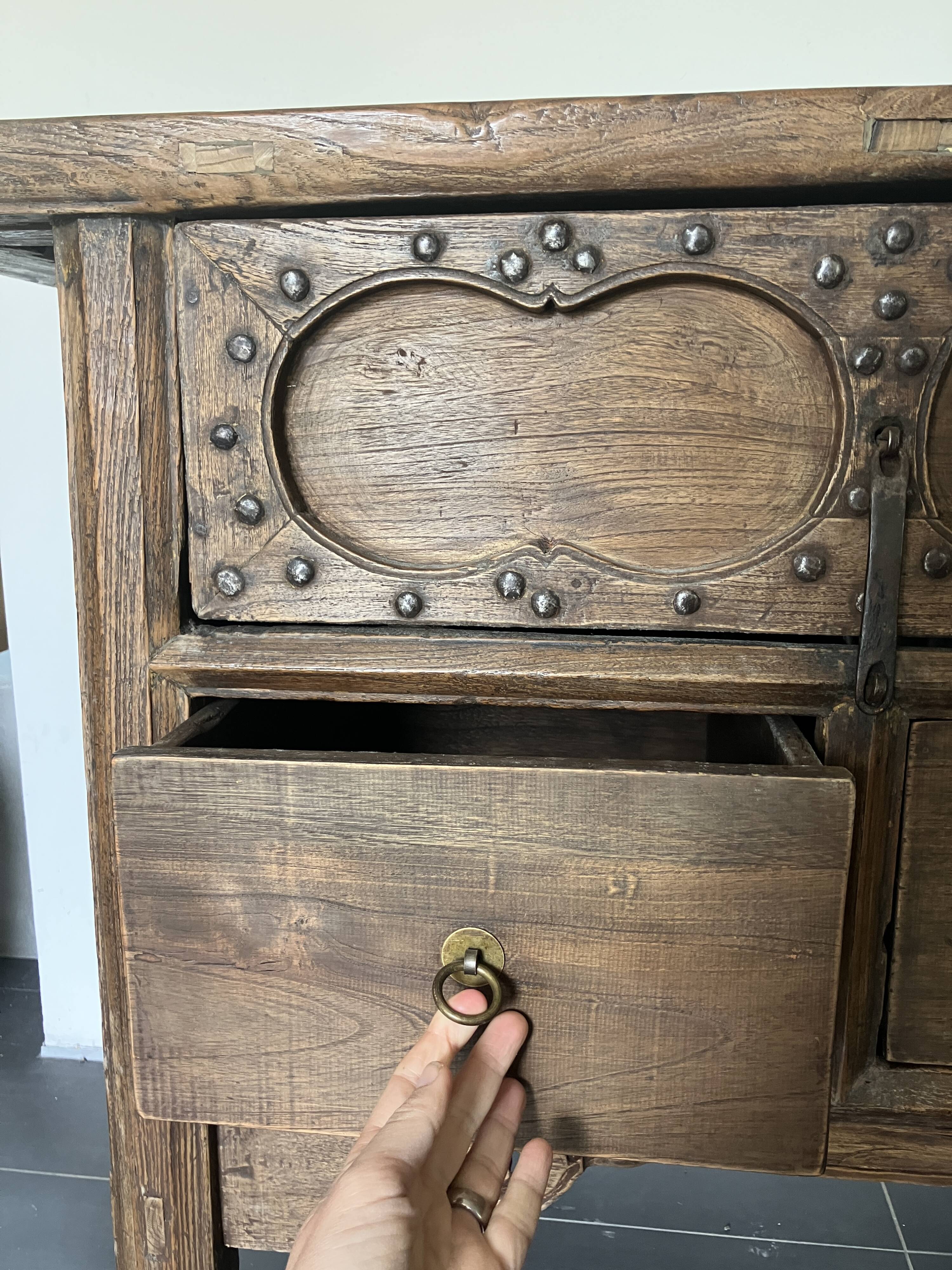 Very old elm wood with carved patterns and ironwork pieces.