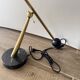 Eichholtz Cordero desk lamp in brass, black metal and marble.