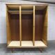 French wardrobe with tapered legs, 3 doors, 1 mirror (27*130), and 1 drawer.
