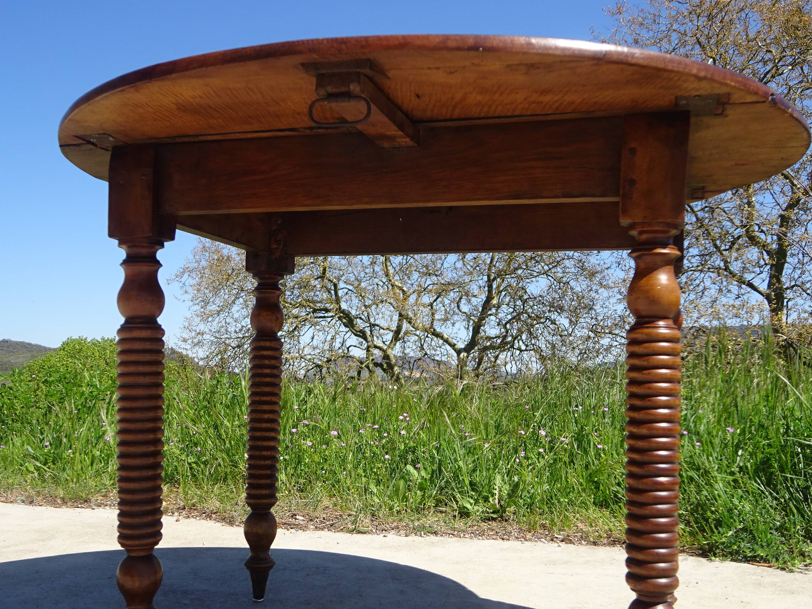 Antique walnut console table with honey spoon legs.