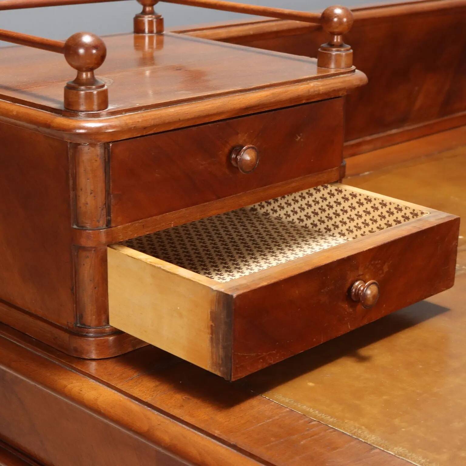 Antique walnut desk with a leather-covered top, Italy, late 19th century.