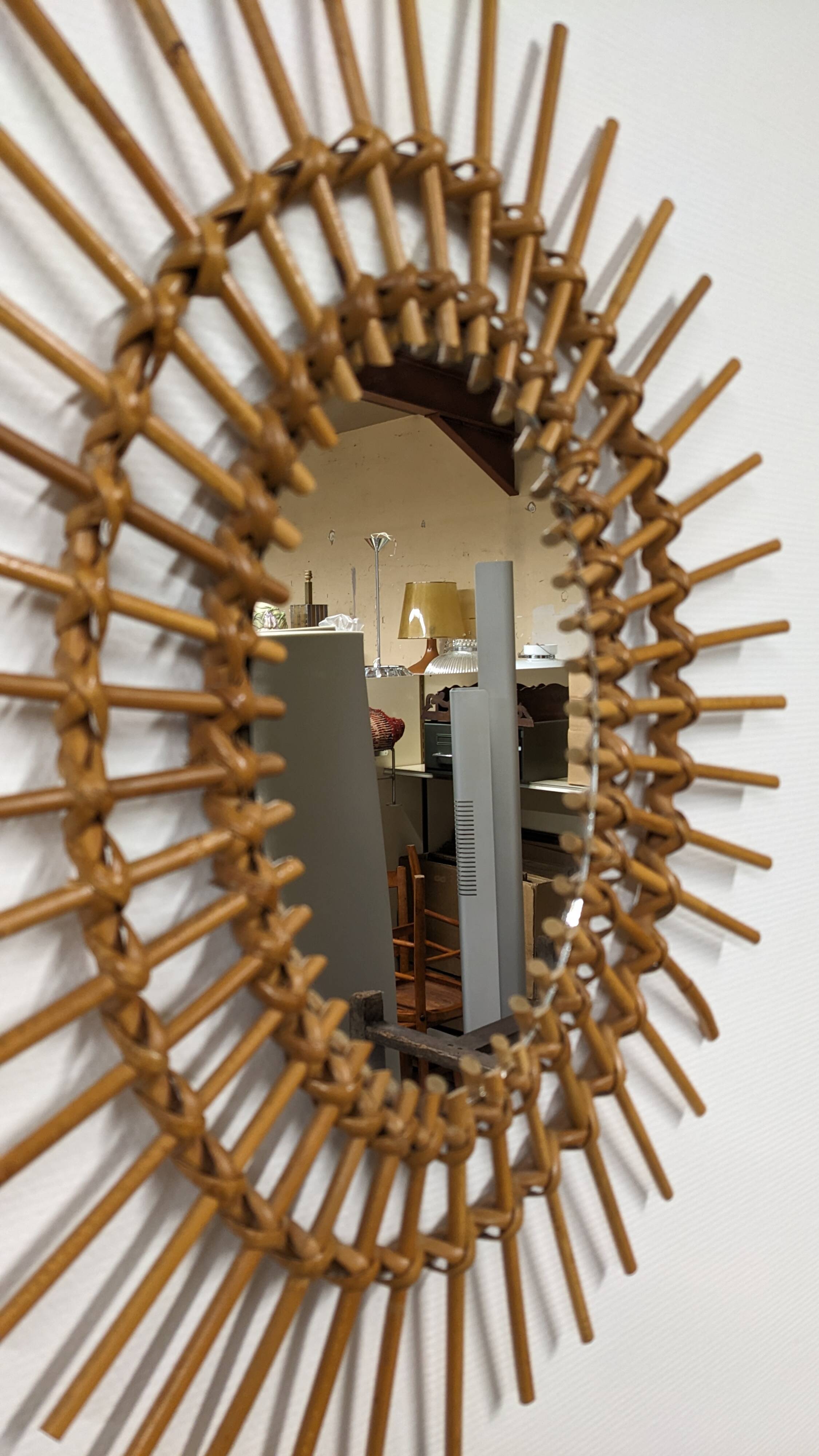 Oval rattan mirror, France circa 1960.