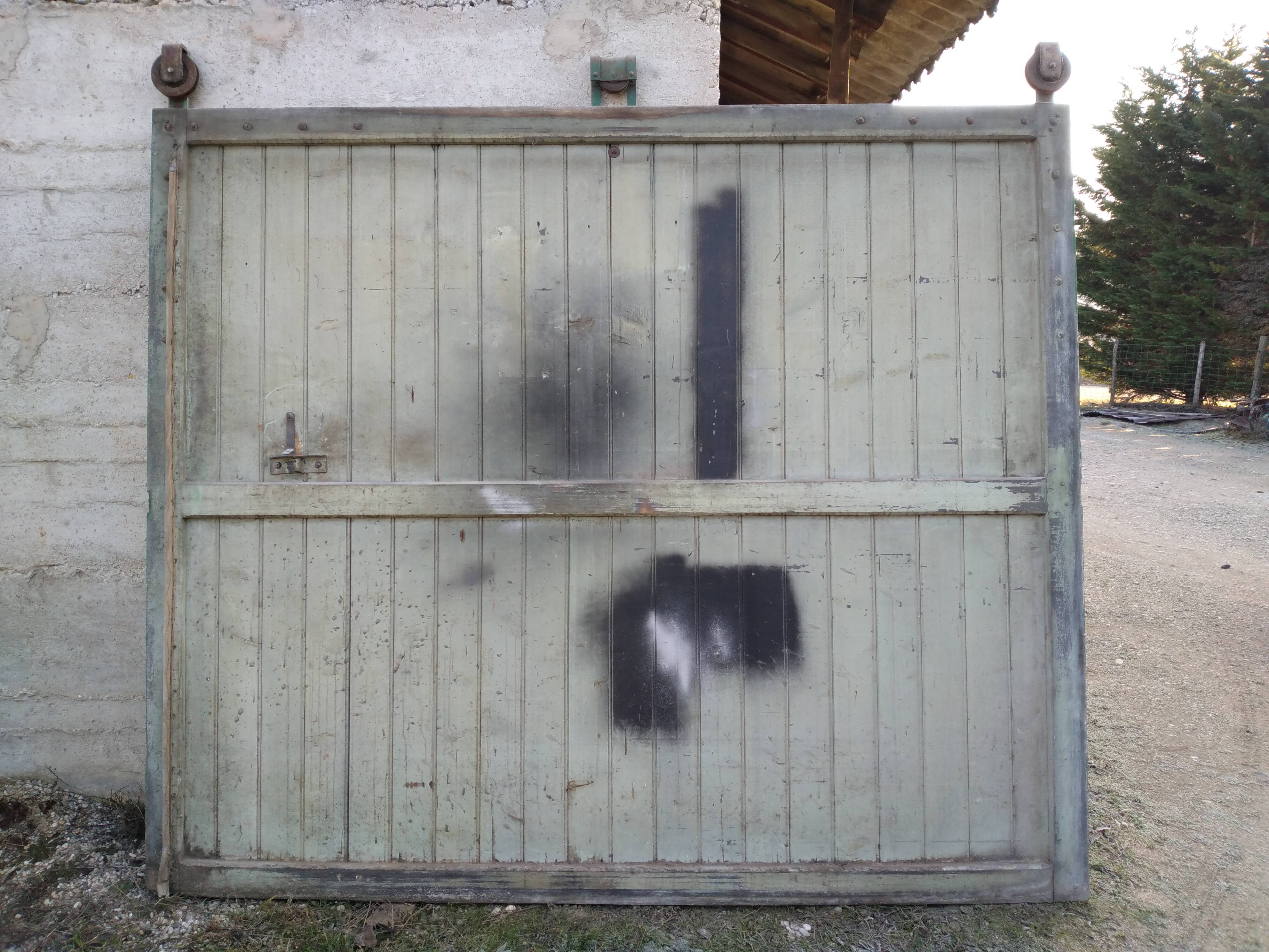 Old wooden door with pulley