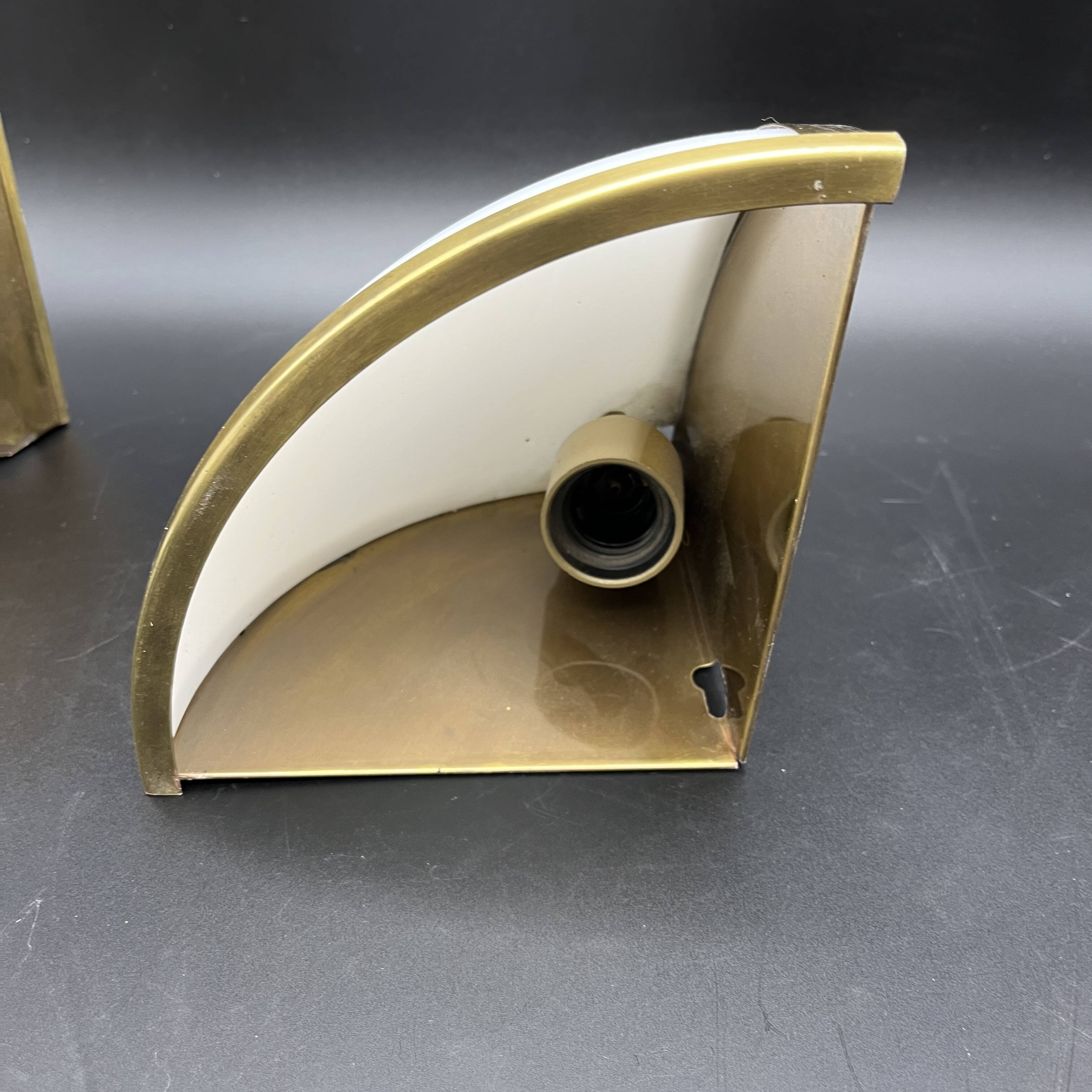 Pair of corner sconces in golden brass and matt opaline