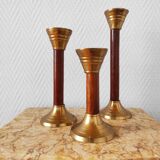 Set of three vintage wooden and brass candlesticks