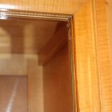 Art deco showcase in waved sycamore