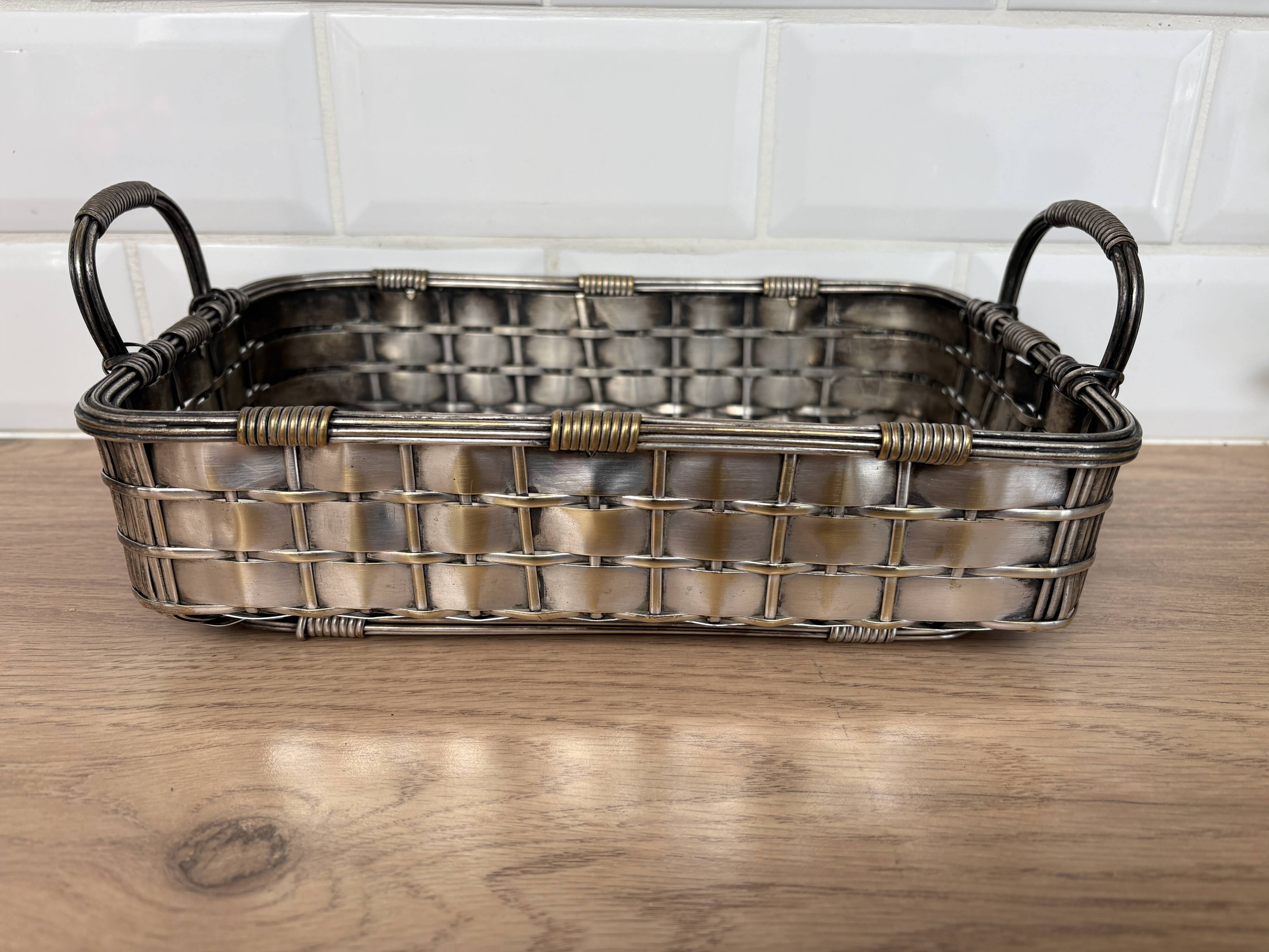 Woven silver-plated metal basket.