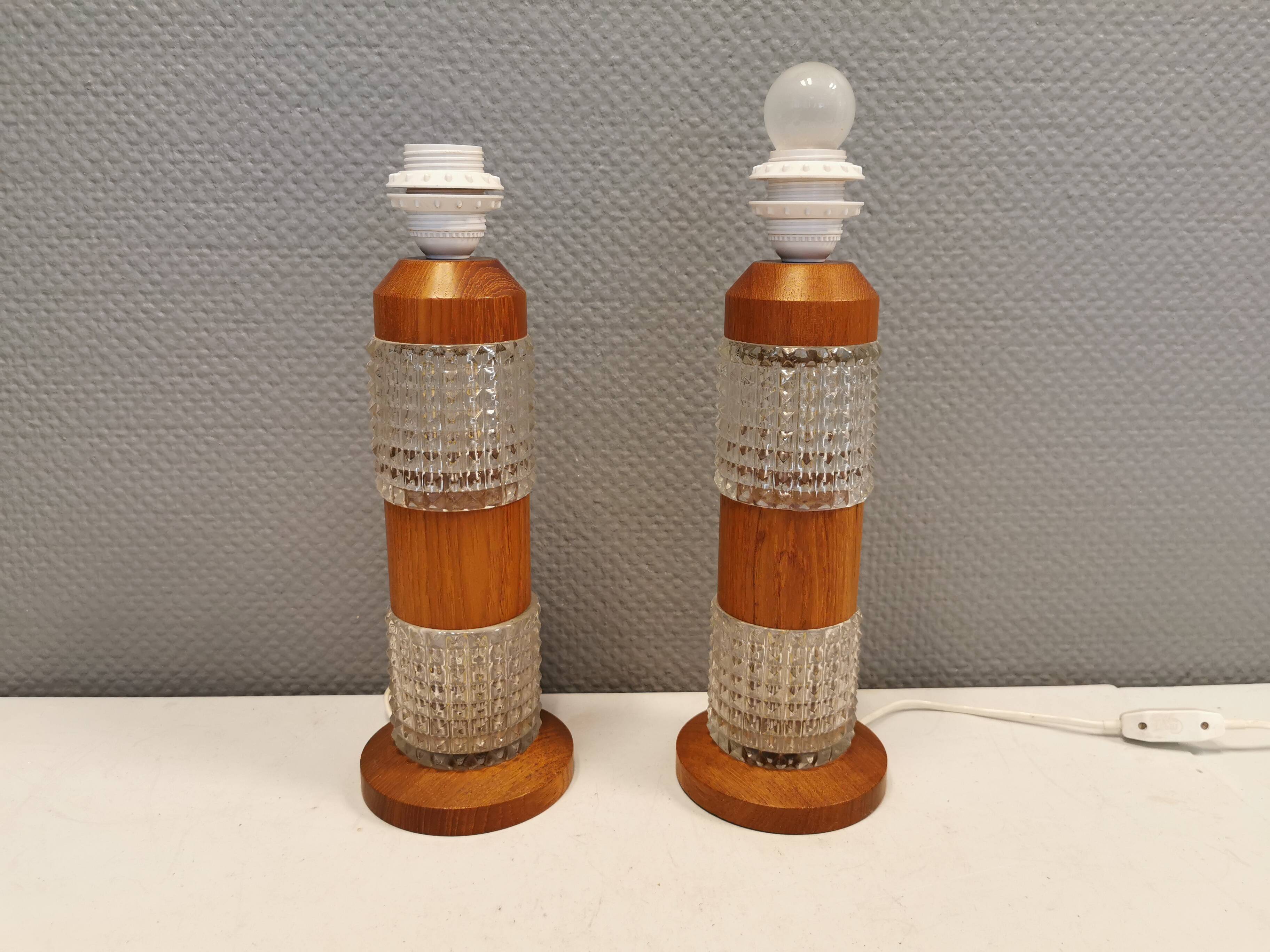 Swedish table lamps made of teak wood and hard pressed crystal glass.