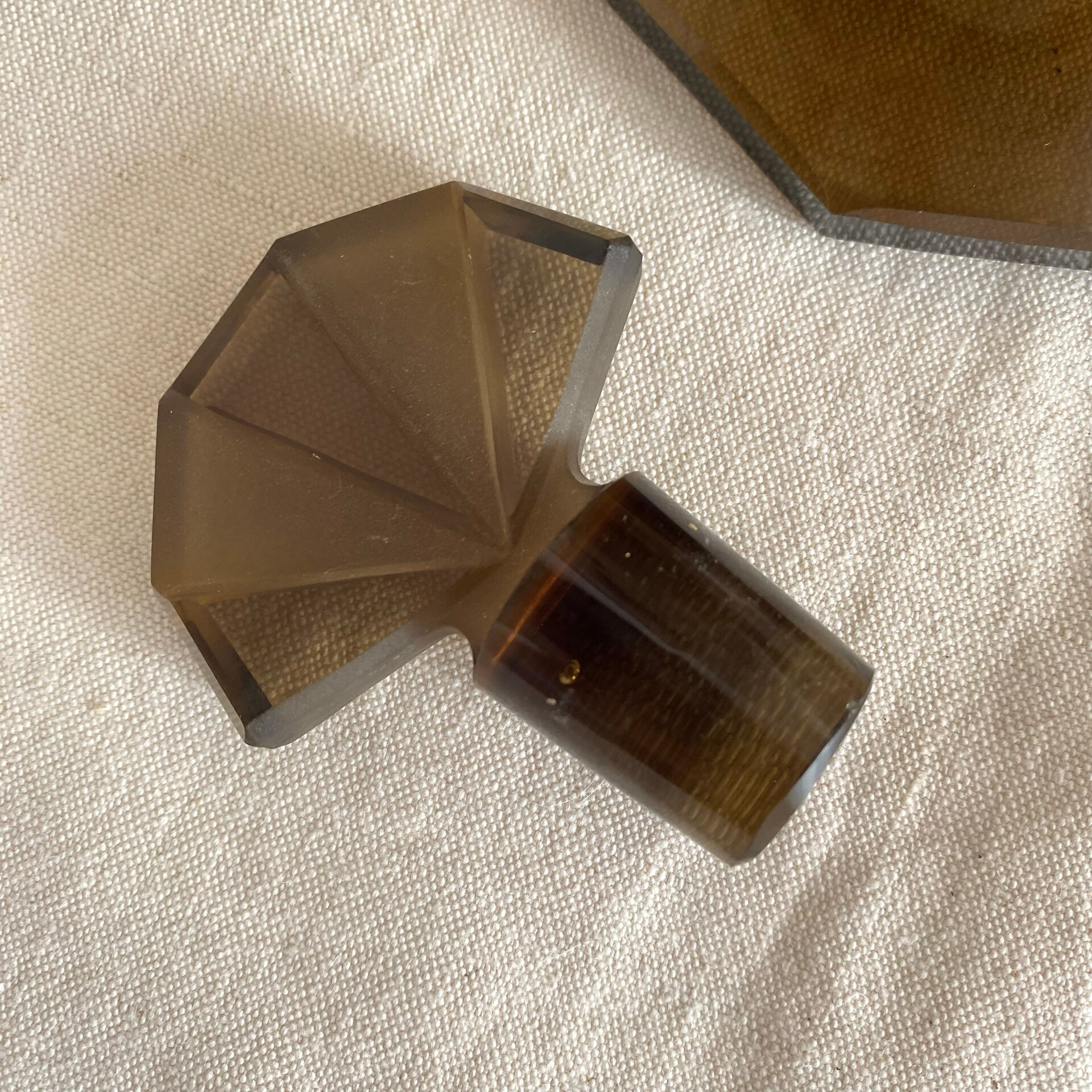 Art Deco smoked glass carafe with fan-shaped stopper.