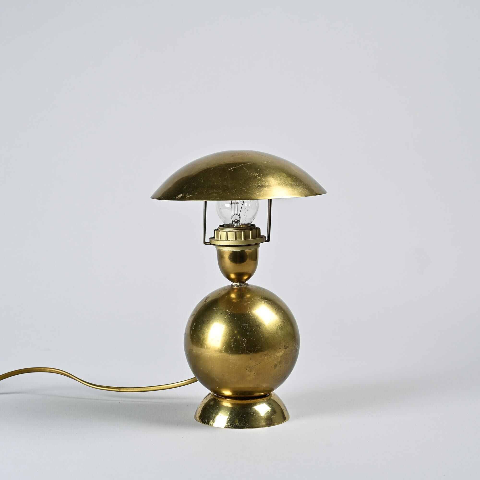 Pair of table lamps in gilded brass, created by Mathias, France, circa 1970.