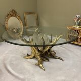 Round glass and brass table by designers Richard and Isabelle Faure