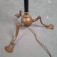 Art and Craft tripod floor lamp in bronze.