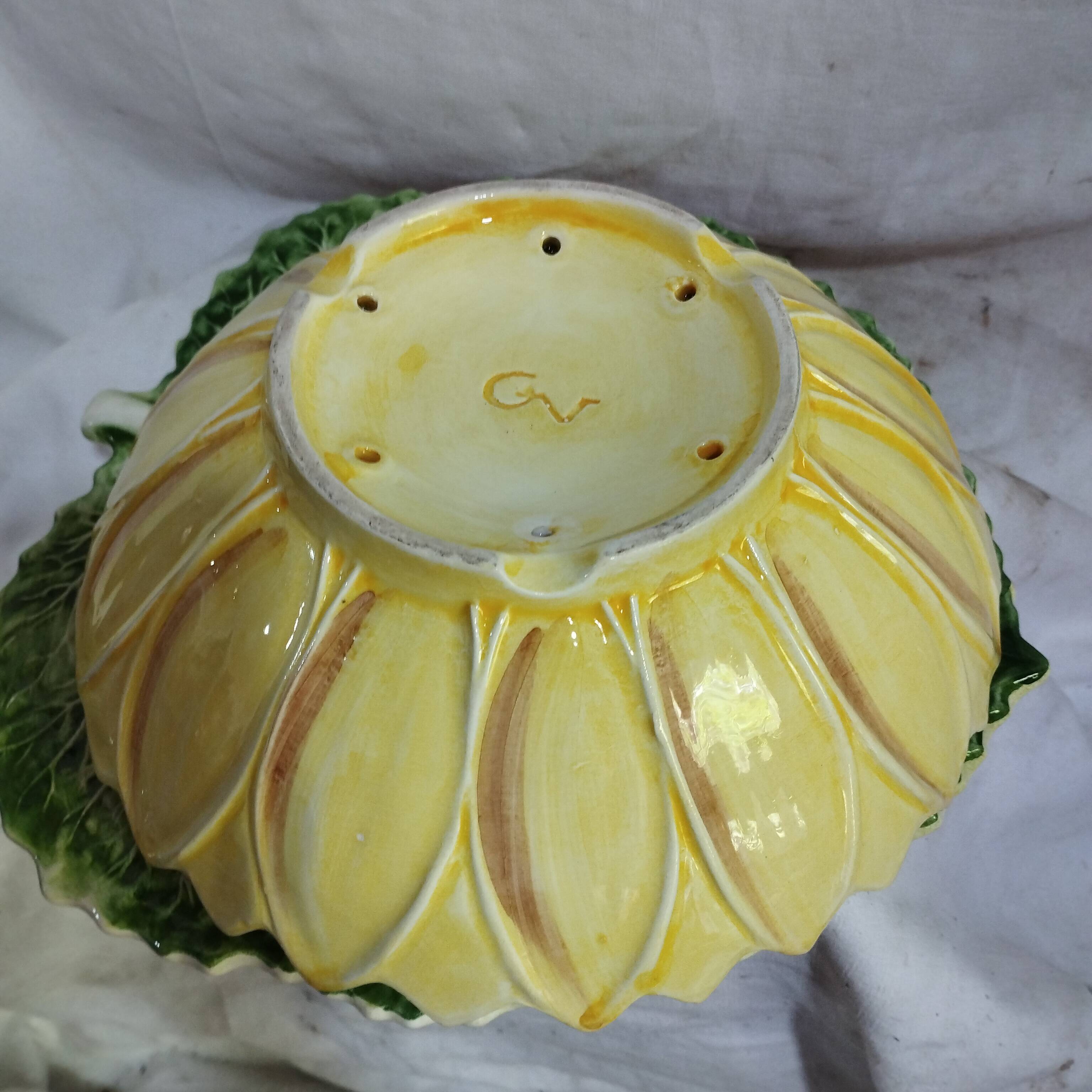 old strawberry drainer in slipware