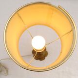 Lampe à poser cherubin en laiton.