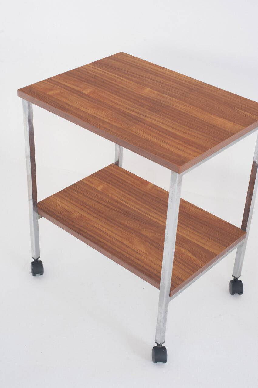 Vintage side table on wheels. Chrome-plated iron tube and wood. France, 1970s.