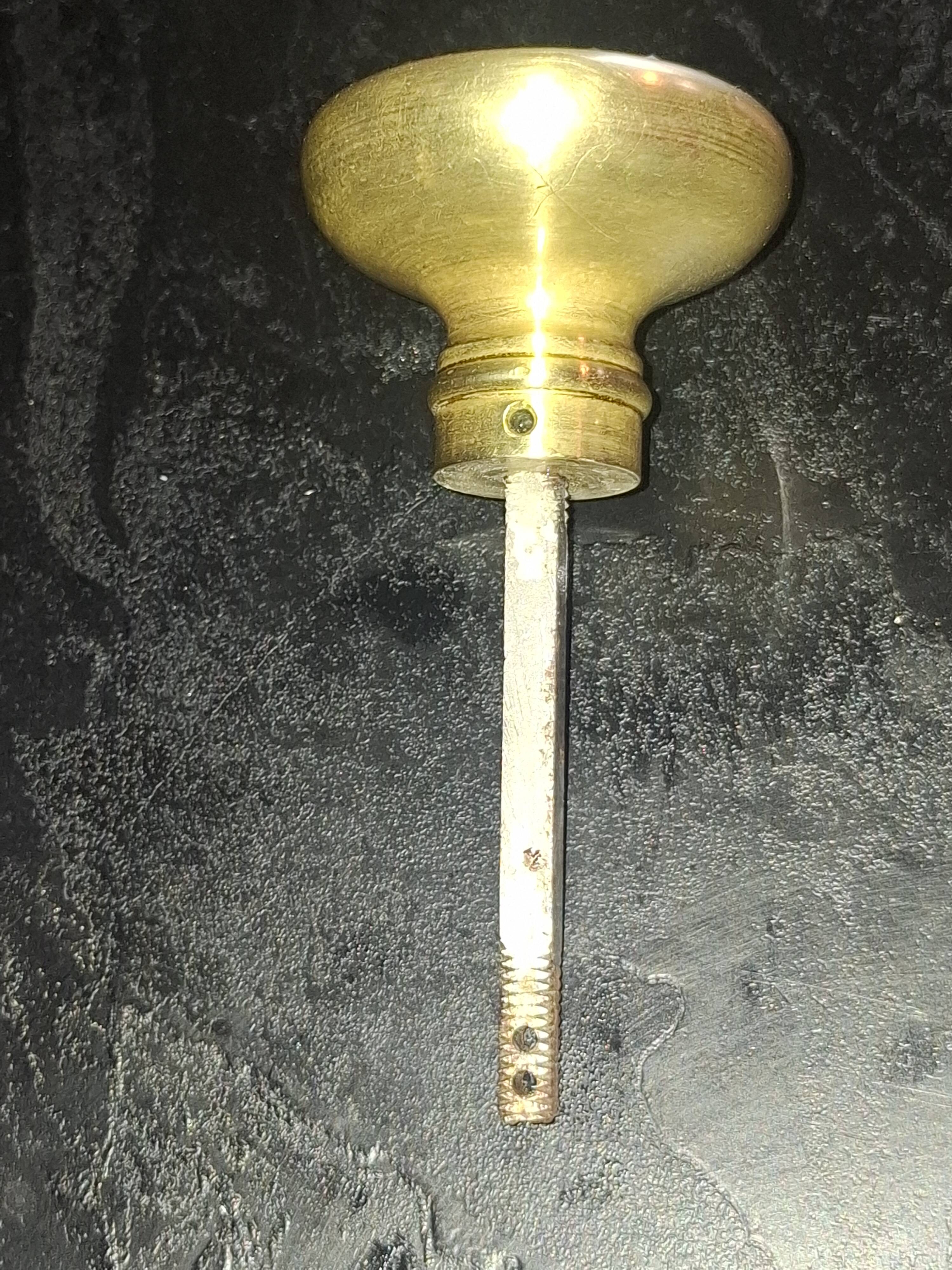 Sublime door handle made of brass with a bevelled mirror front.