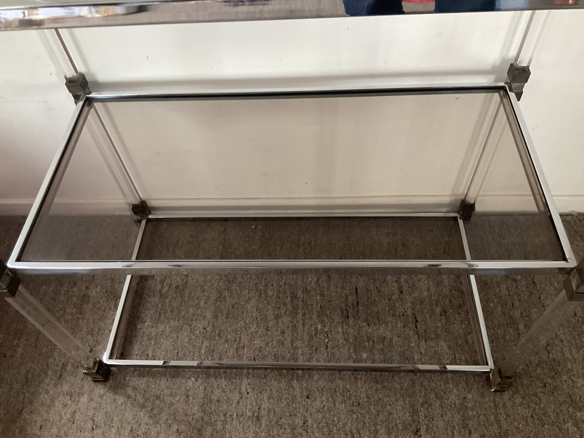 Vintage shelf in lucite, brass, and smoked glass from the 1970s.