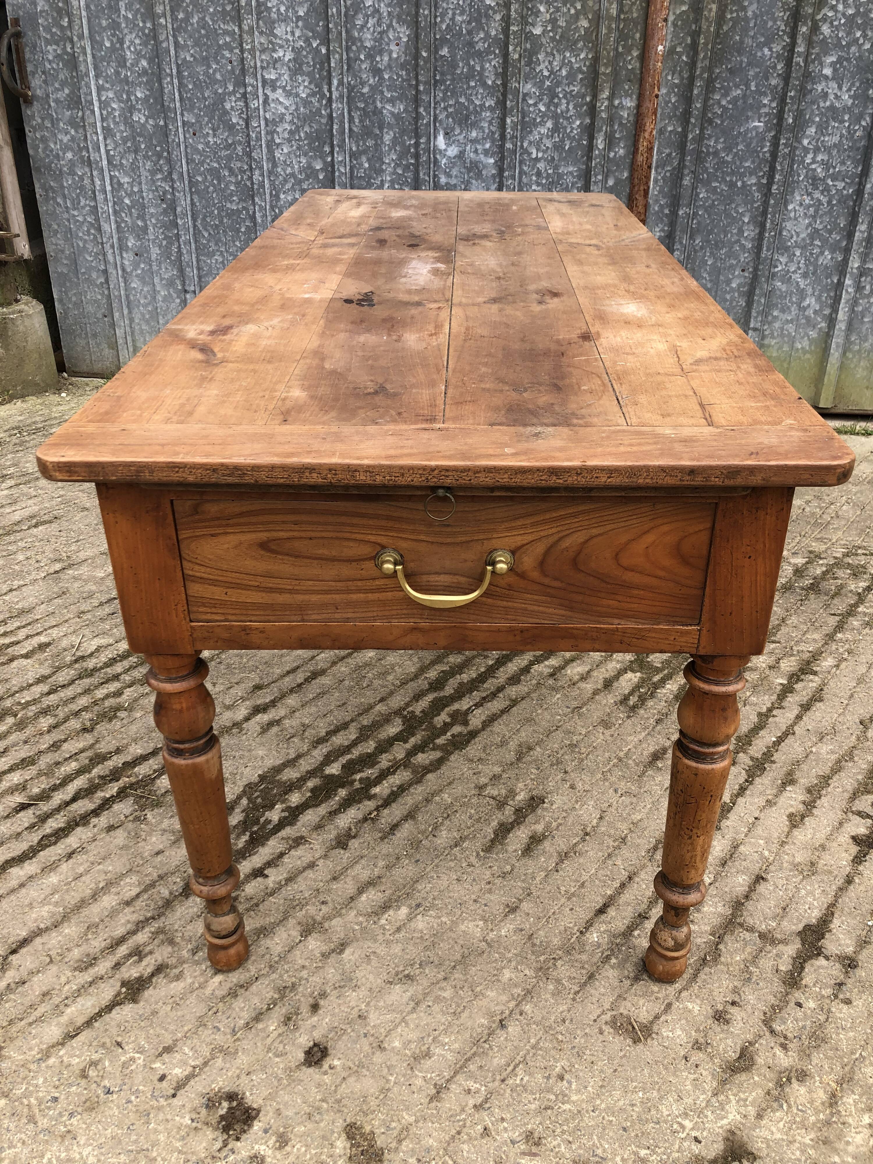 Antique cherry farmhouse table with 2 drawers and 1 pull-out