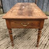 Antique cherry farmhouse table with 2 drawers and 1 pull-out