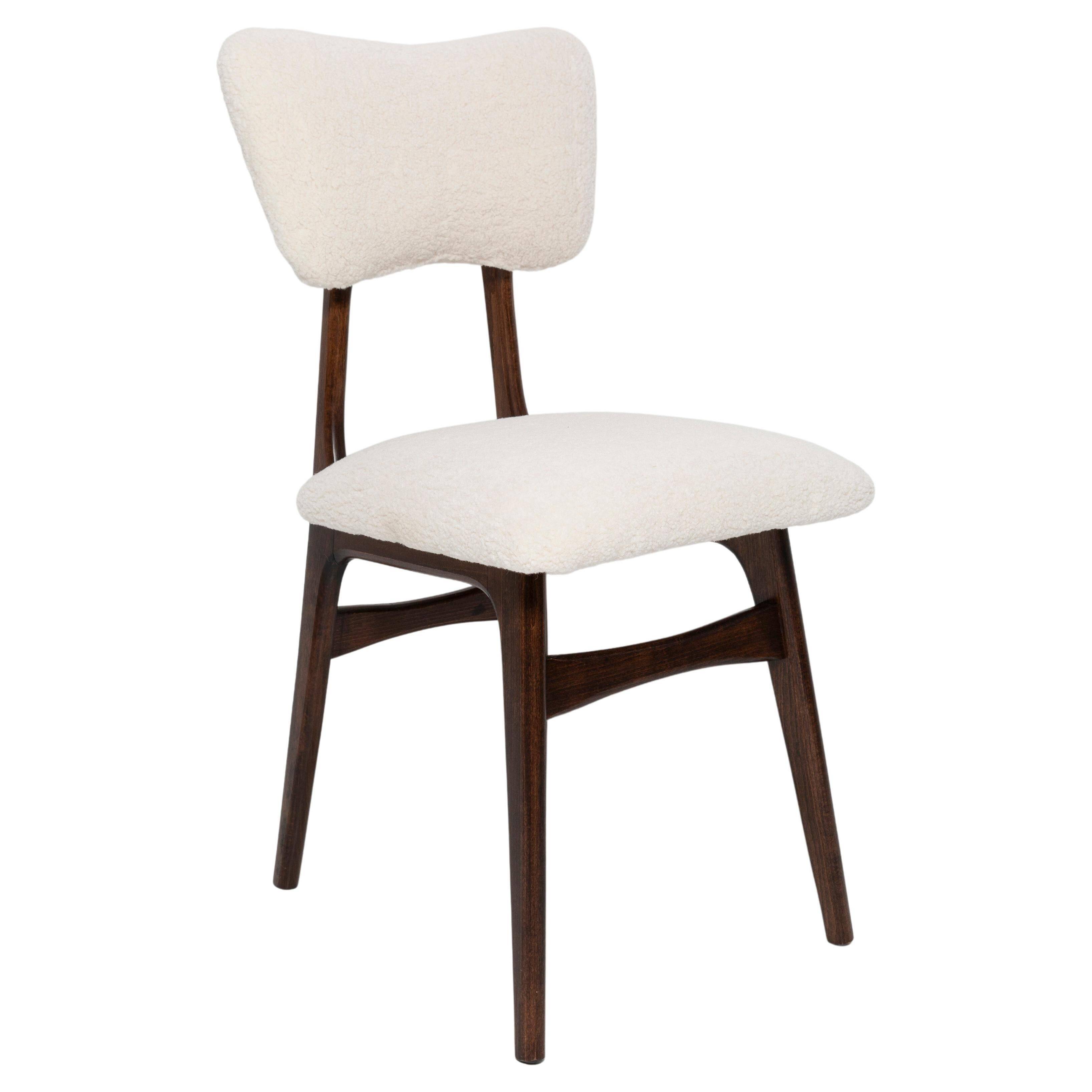 20th-century walnut and light cream boucle butterfly chair, Europe, 1960.