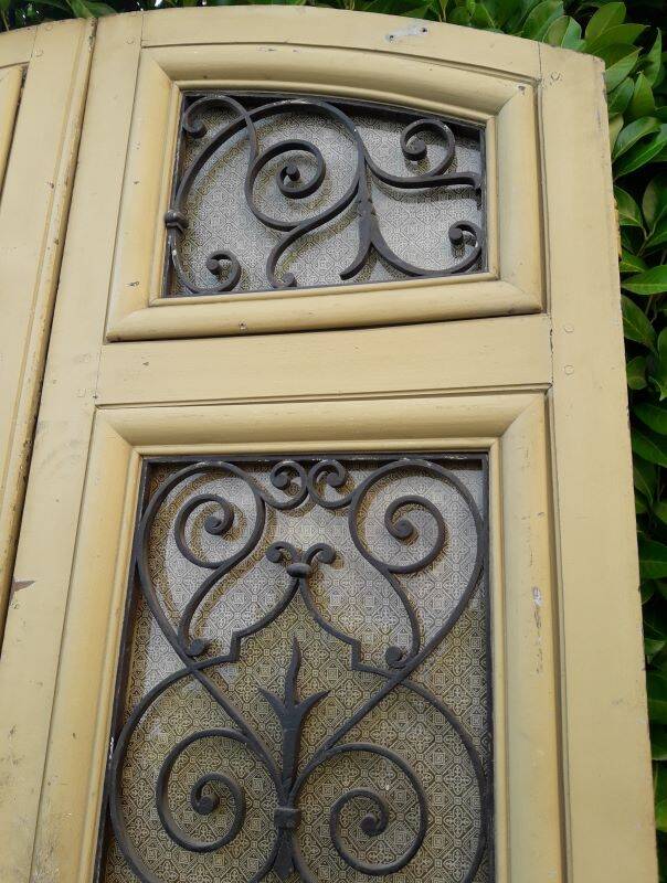 19th century double arched entrance door in oak with grilles and old glass