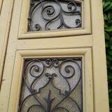 Porte d'entrée cintrée double en chêne, grilles et verre, XIXème