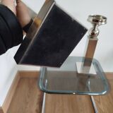 Pair of designer candlesticks in chromed metal.