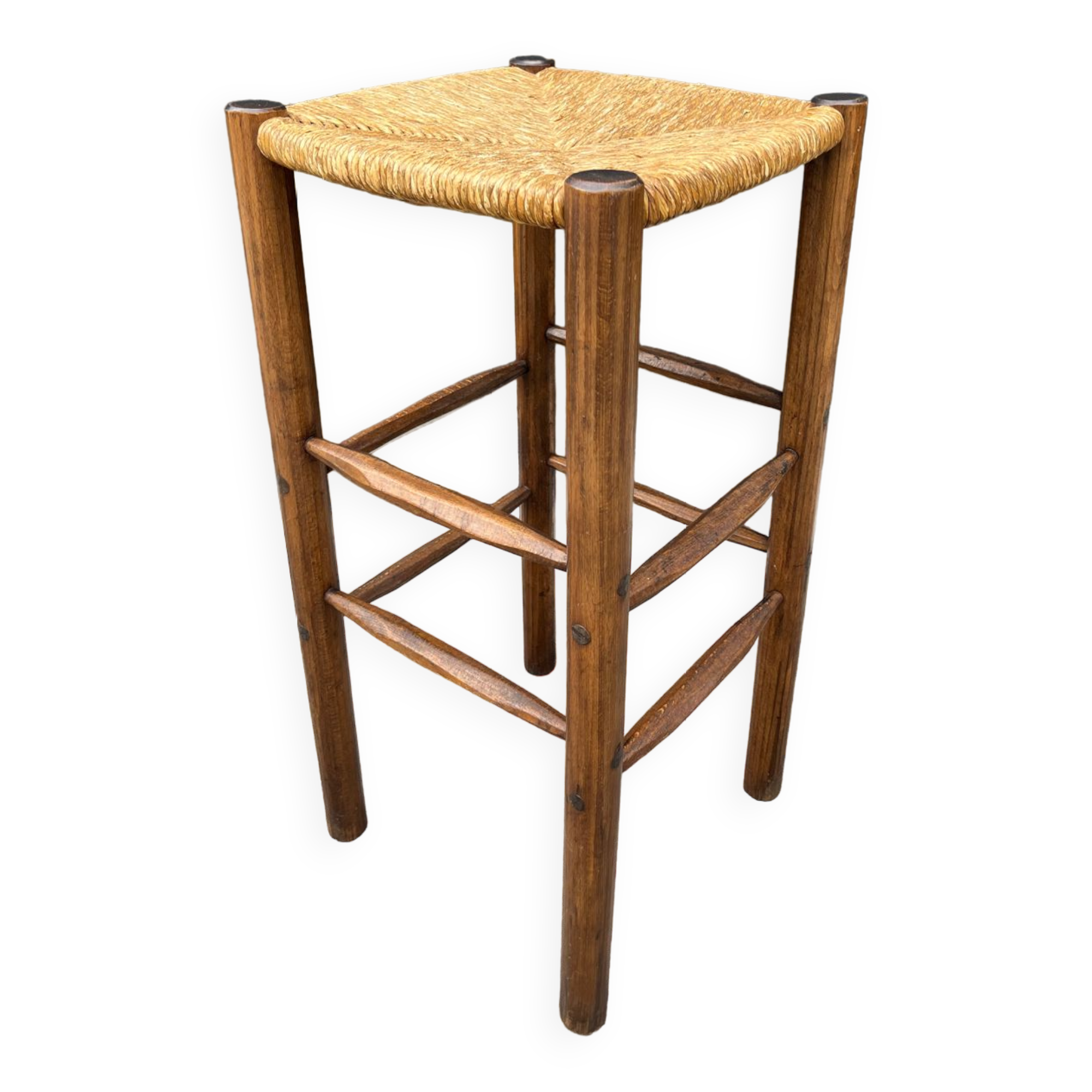 Old high bar stool in wood and straw