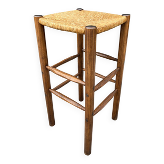 Old high bar stool in wood and straw