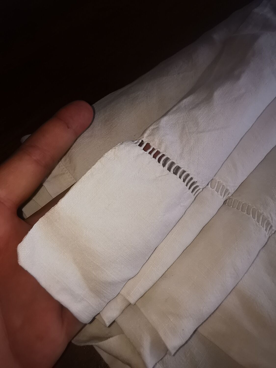 Antique embroidered linen sheet with a monogram.