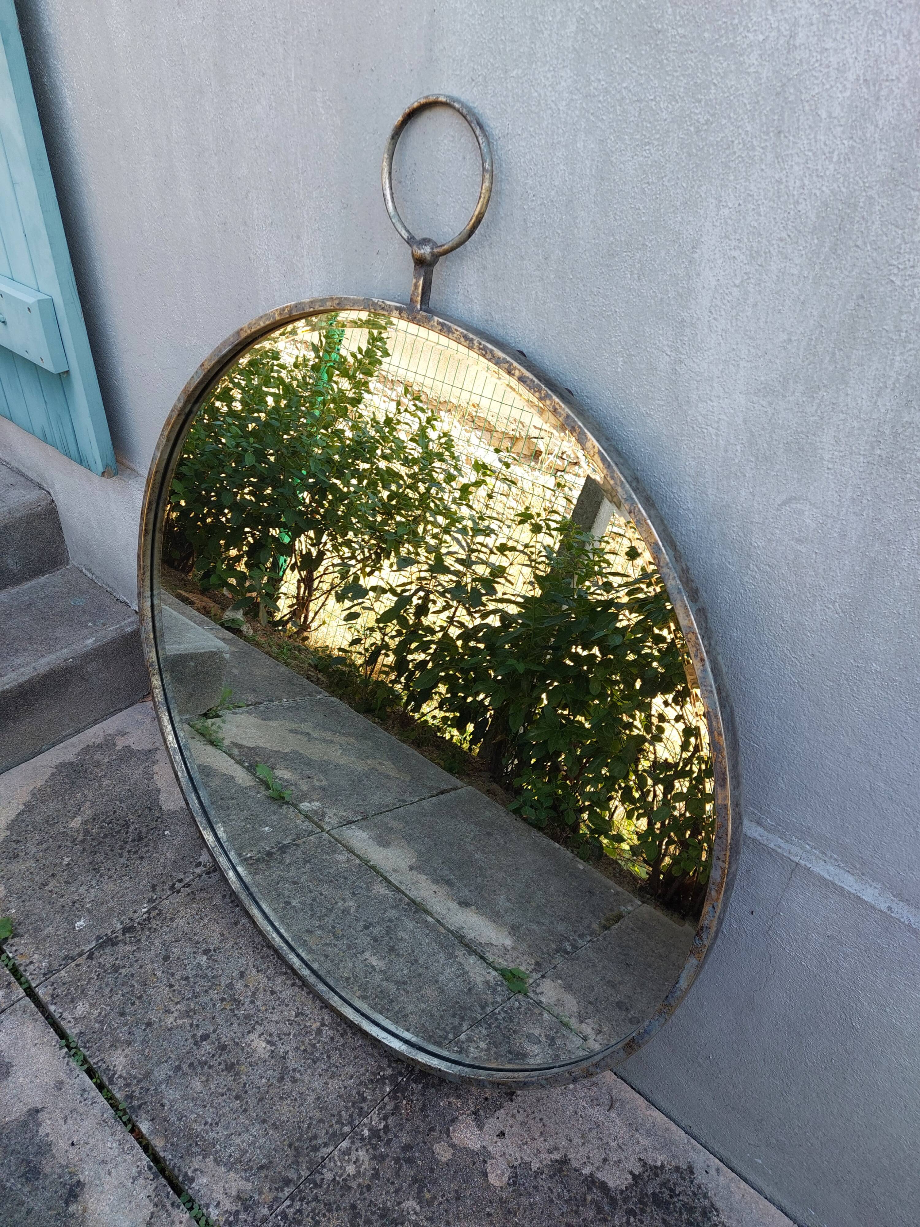 Round patinated mirror