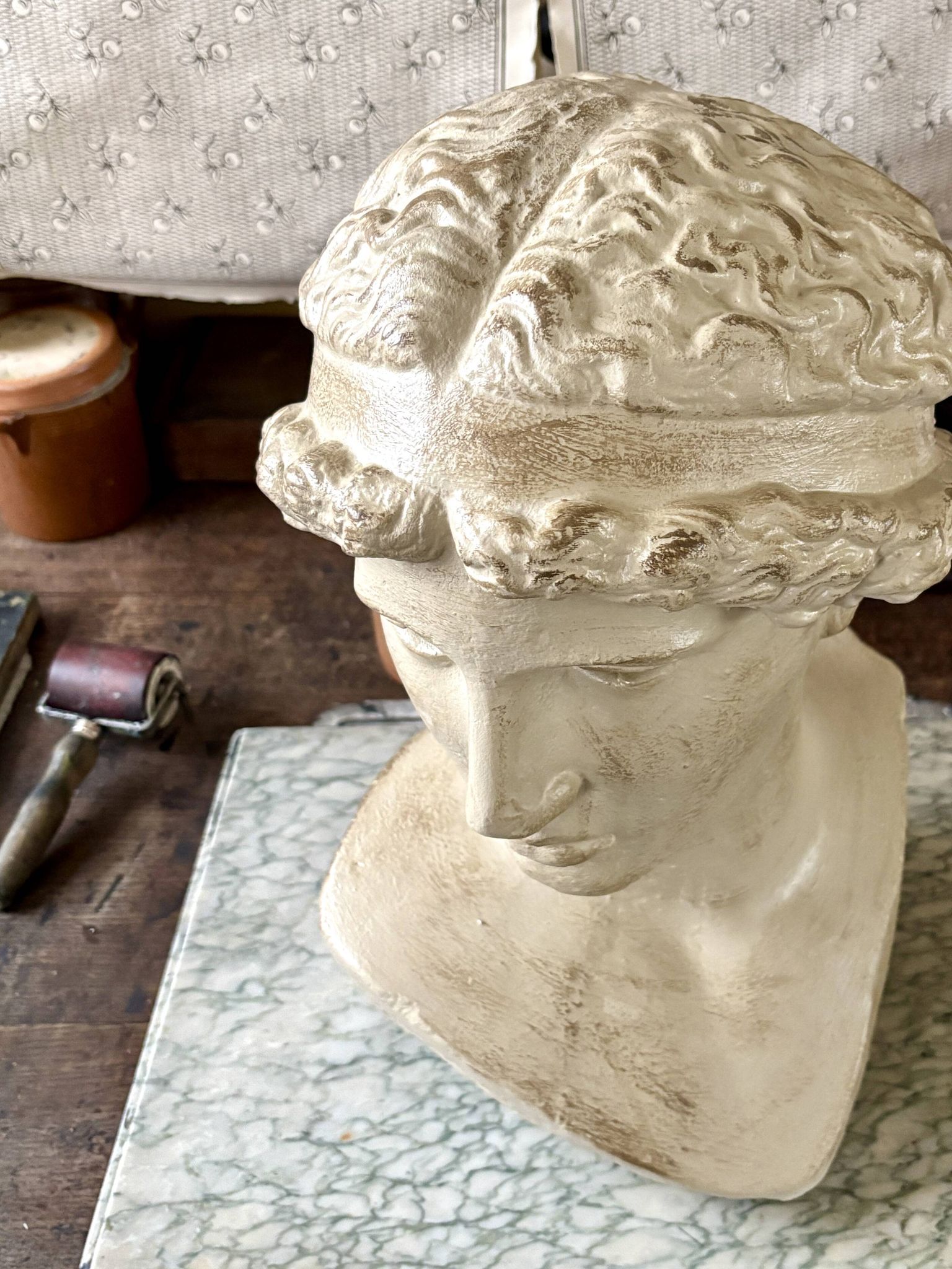 Concrete bust painted in beige - reproduction, detail of "The Dying Slave"