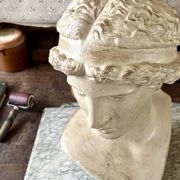 Concrete bust painted in beige - reproduction, detail of "The Dying Slave"