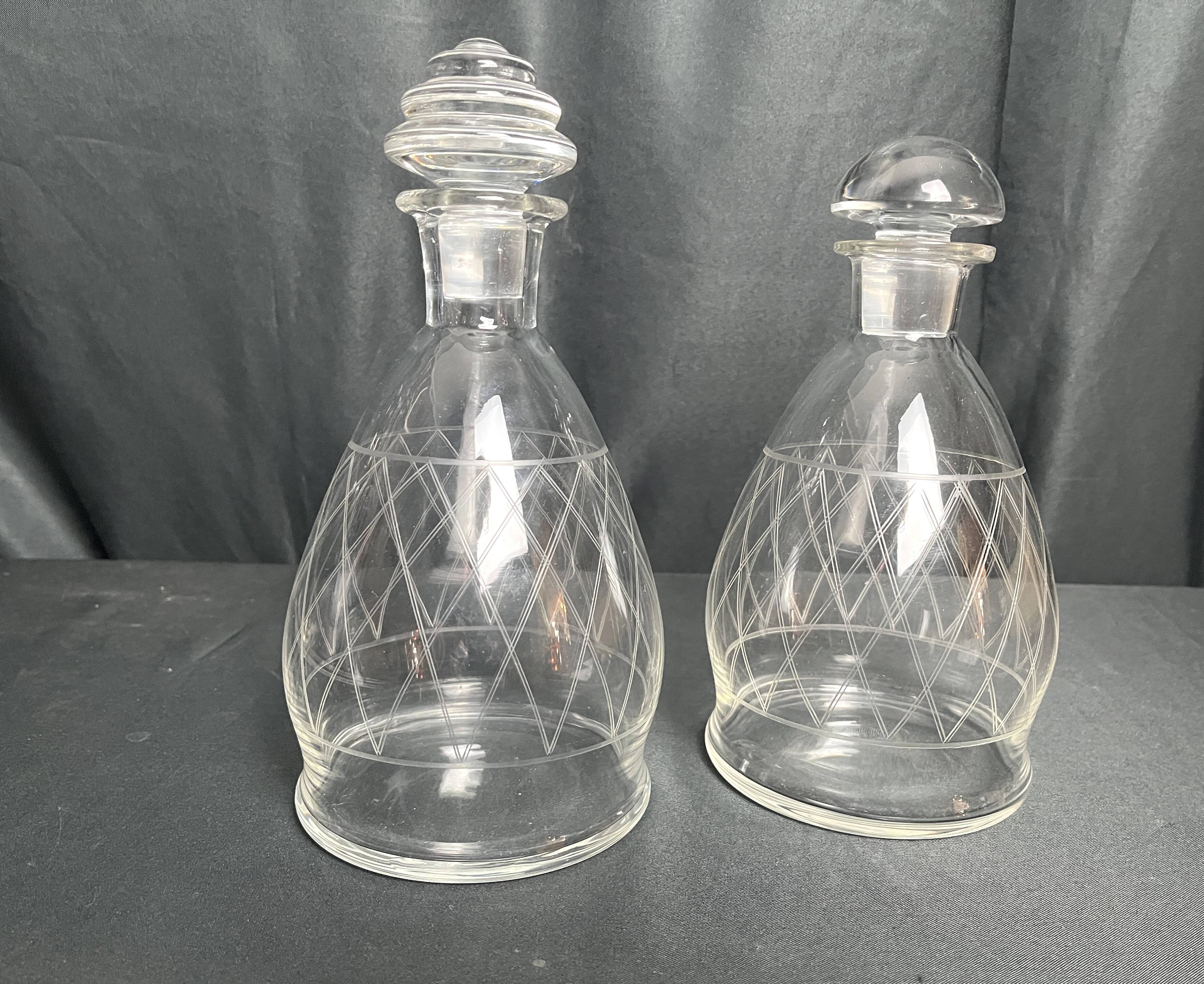 Tableware, two engraved crystal carafes with stoppers from around 1940.