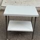 Rolling dessert trolley with 2 white formica shelves and steel, 1980.
