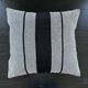 Woven striped cushion