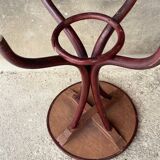 Pedestal table in curved wood