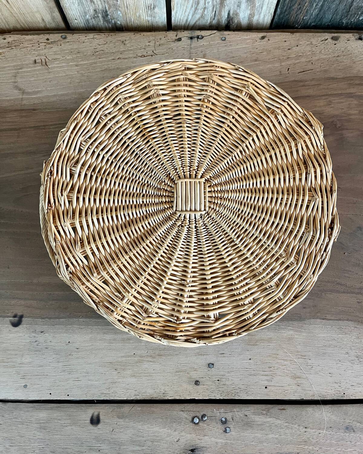 Antique flat round rattan basket