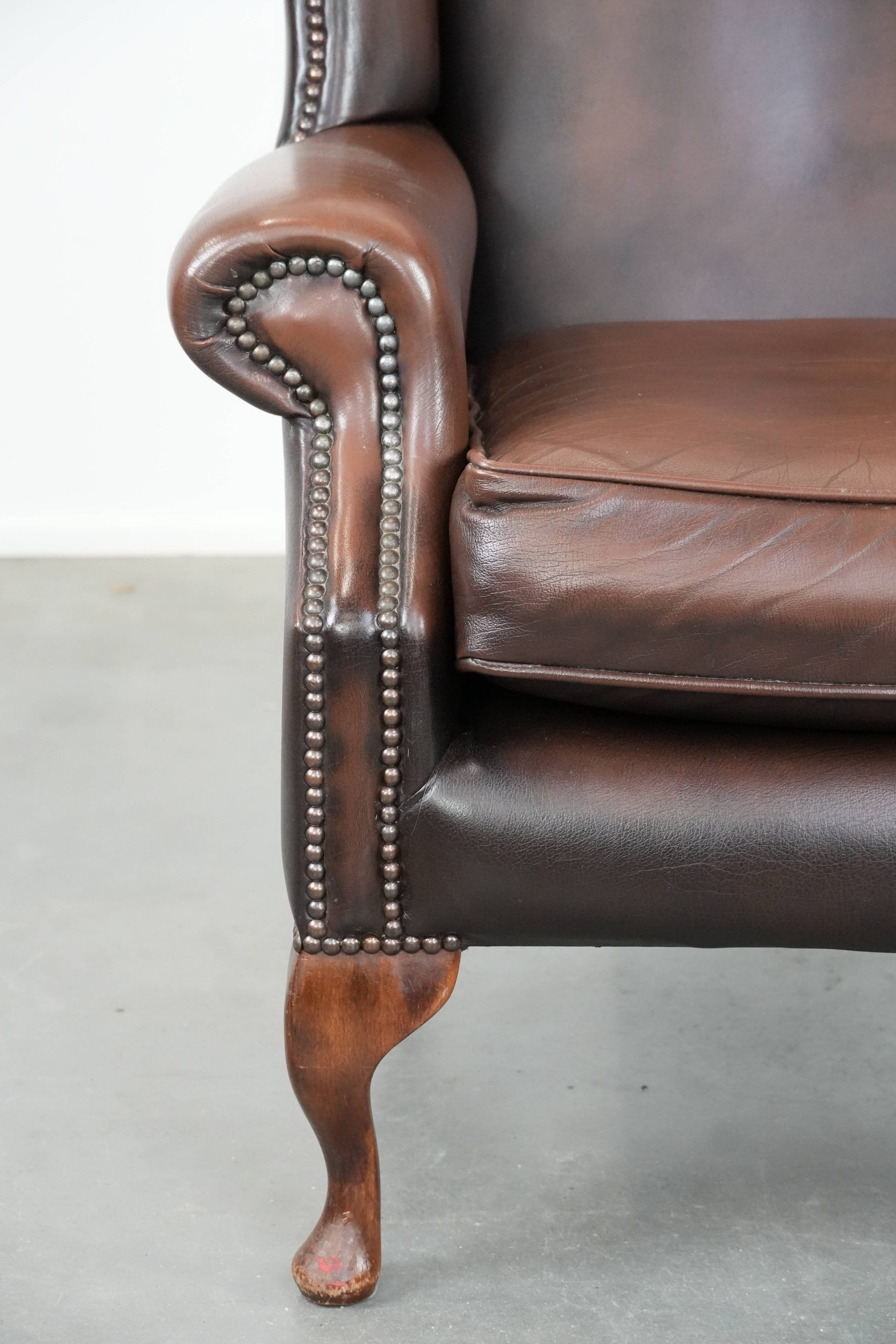 Brown smooth cow leather Chesterfield wingback armchair in English style