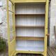 Antique yellow display cabinet
