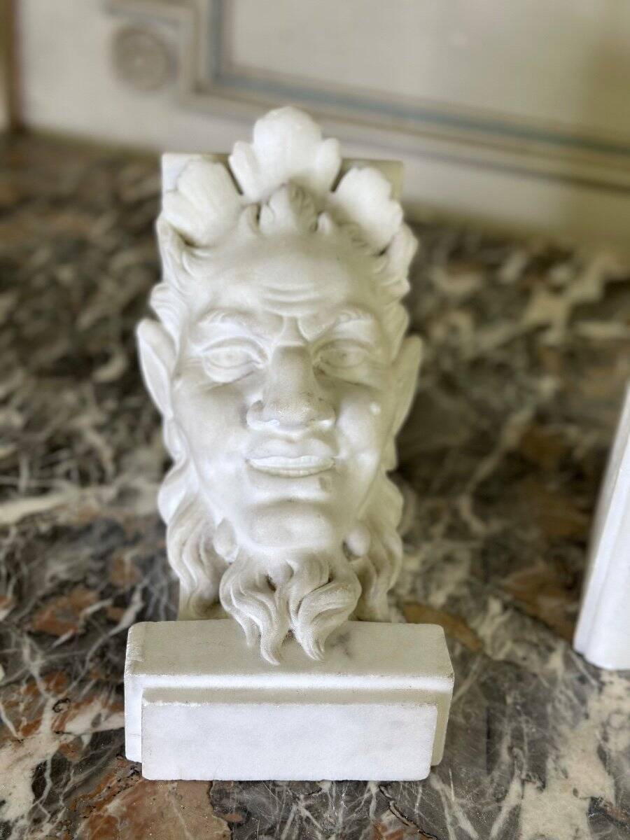 Pair of white statuary marble consoles, with faun heads