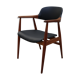 Vintage armchair in teak and black leather model Casina 60s